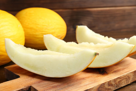 Fresh ripe melons on wooden table, closeupの写真素材