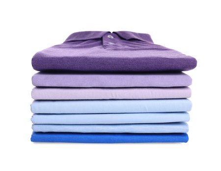 Stack of clean colorful t-shirts isolated on whiteの写真素材