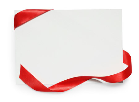 Red satin ribbon and blank card isolated on white, top viewの写真素材