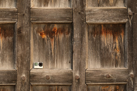 One modern action camera on wooden surfaceの写真素材