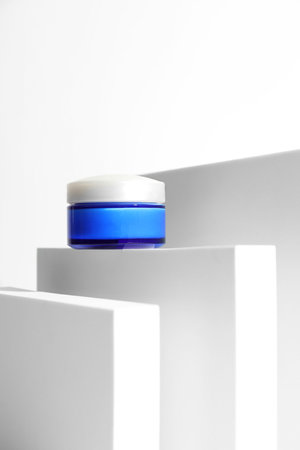 Stylish presentation of facial cream on white backgroundの写真素材