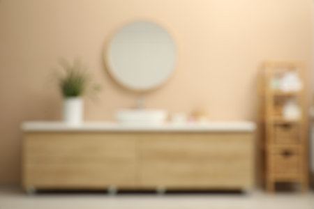 Blurred view of furniture and mirror in bathroomの写真素材