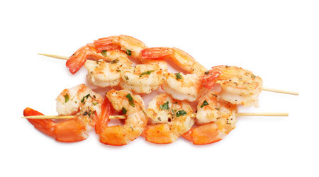 Skewers with delicious grilled shrimps isolated on white, top viewの写真素材