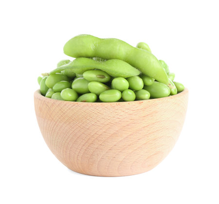 Raw green edamame soybeans and pods isolated on whiteの写真素材