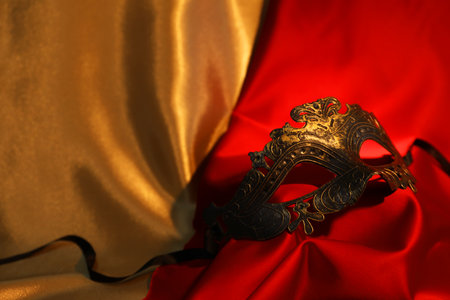 Beautiful carnival mask on silk fabric, closeupの写真素材