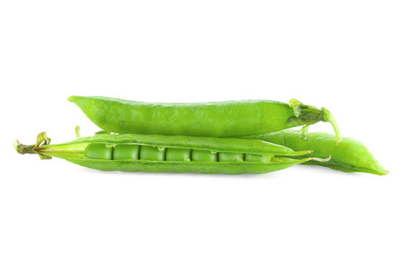 Green fresh peas and pods isolated on whiteの写真素材