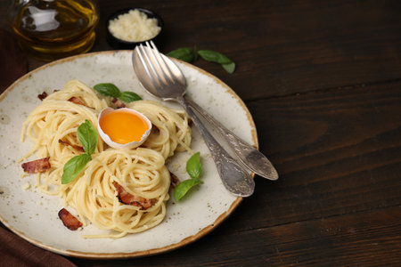 Delicious pasta Carbonara served on wooden tableの写真素材