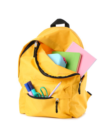 Backpack with different school stationery isolated on whiteの写真素材