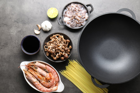 Ingredients for wok on grey table, flat layの写真素材