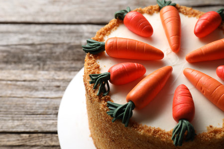 Delicious carrot cake on wooden table, closeupの写真素材