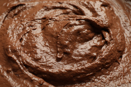 Fresh chocolate dough as background, closeup view
