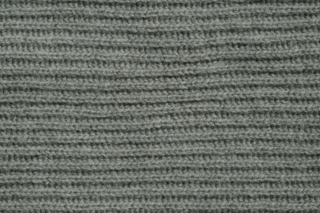 Texture of gray knitted fabric as background, top viewの写真素材