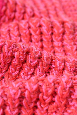 Texture of bright knitted fabric as background, closeup