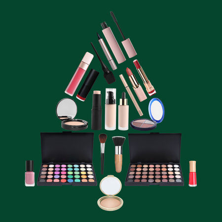 Christmas tree shape made with different makeup products on dark green backgroundの写真素材