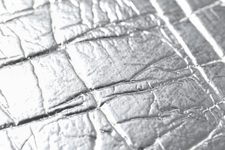 Shiny silver surface as background, closeup view