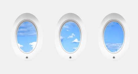 Beautiful sky with clouds, view through airplane windows in white sidewall of cabinの写真素材