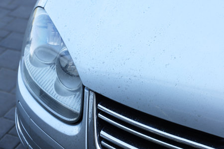 Modern auto with dirty stains, closeup viewの写真素材