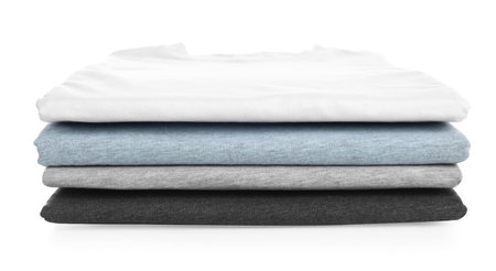 Stack of clean colorful t-shirts isolated on whiteの写真素材