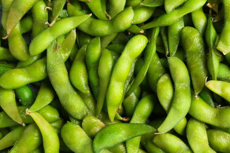 Fresh edamame pods as background, top viewの写真素材