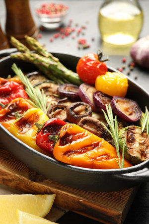 Delicious grilled vegetables in baking dish on table, closeupの写真素材
