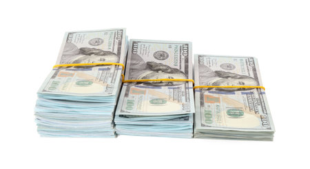Stacks of dollar banknotes isolated on whiteの写真素材