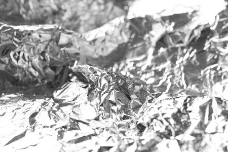 Shiny silver tinfoil surface as background, closeupの写真素材