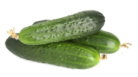 Three fresh green cucumbers isolated on white, above viewの写真素材