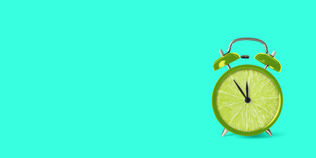 Juicy lime on alarm clock dial against turquoise background. Creative poster with space for text, banner designの写真素材