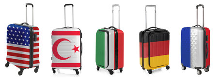 Suitcases painted in national flags of different countries isolated on white, setの写真素材