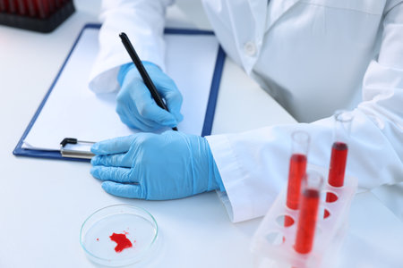 Laboratory testing. Doctor working at white table indoors, closeupの写真素材