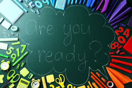 Chalkboard with question Are You Ready and stationery, flat layの写真素材