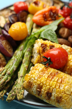 Delicious grilled vegetables on blue table, closeupの写真素材
