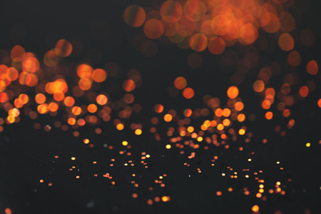 Beautiful shiny golden glitter on black background, closeupの写真素材