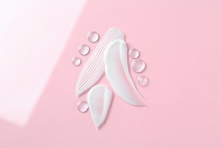 Smears of different cosmetic products on color background, top viewの写真素材