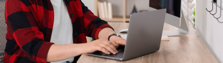 Programmer working with laptop in office, closeup. Banner designの写真素材