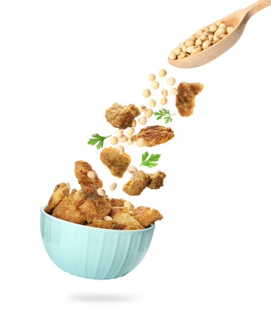 Soy meat, beans and bowl in air on white backgroundの写真素材
