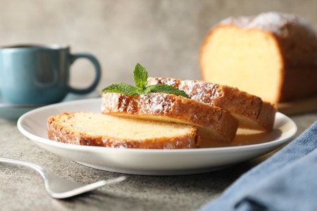 Freshly baked sponge cake and coffee on light gray table, closeupの写真素材