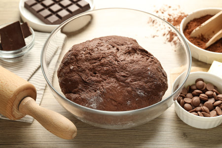Chocolate dough and ingredients on wooden table, closeupの写真素材