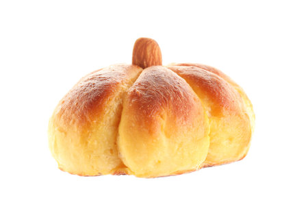 One tasty pumpkin shaped bun isolated on whiteの写真素材