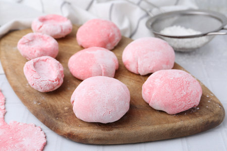 Tasty homemade mochi on white tiled table, closeupの写真素材