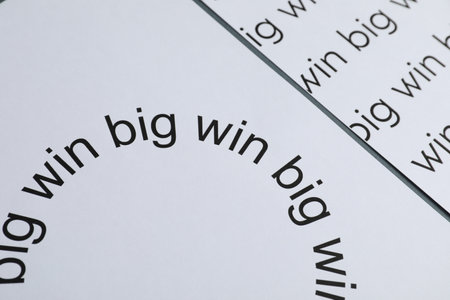 Sheets of paper with words Big win on gray table, closeupの写真素材