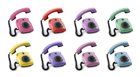 Old telephone with rotary dial of different colors isolated on white, setの写真素材