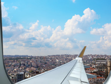 Airplane taking off or landing, view on city from windowの写真素材
