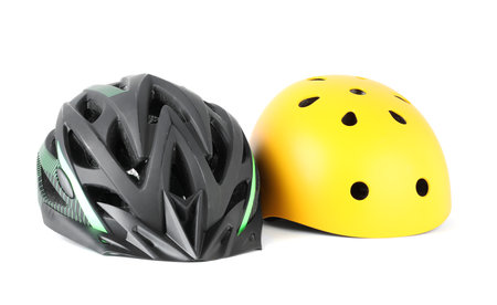 Different protective bicycle helmets isolated on whiteの写真素材