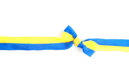 Ribbon with bow in colors of Ukrainian national flag isolated on white, top viewの写真素材