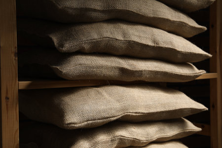 Group of burlap sacks on shelving unitの写真素材