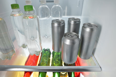 Many different cold drinks in the refrigerator, closeup