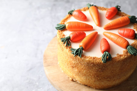 Delicious carrot cake on gray table, closeup. Space for textの写真素材