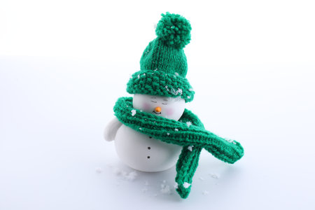 Cute decorative snowman in hat isolated on whiteの写真素材