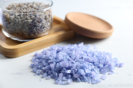 Natural sea salt and lavender on white table, closeupの写真素材